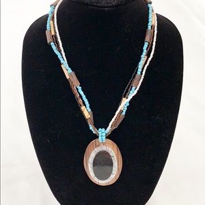 Seed bead necklace with large wooden pendant